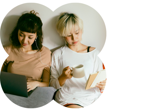 Two teenager girls reading